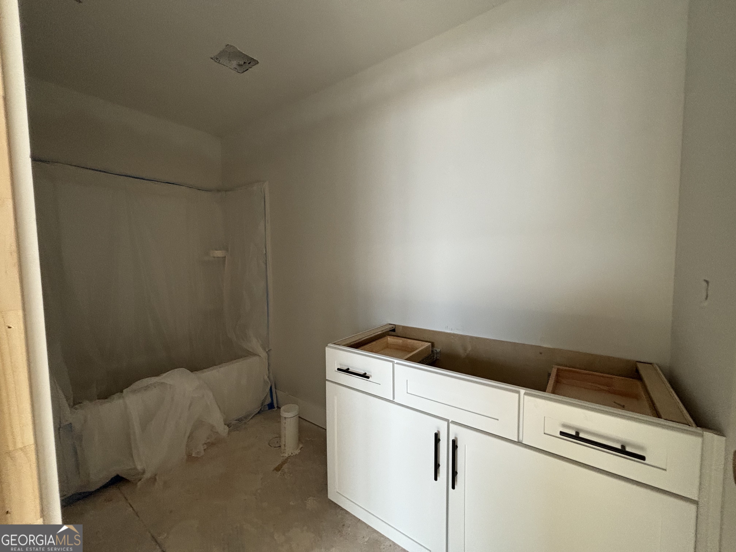 243 Copper Crossing Forsyth, GA 31029 - Photo 16 of 17 a utility room with dryer and washer