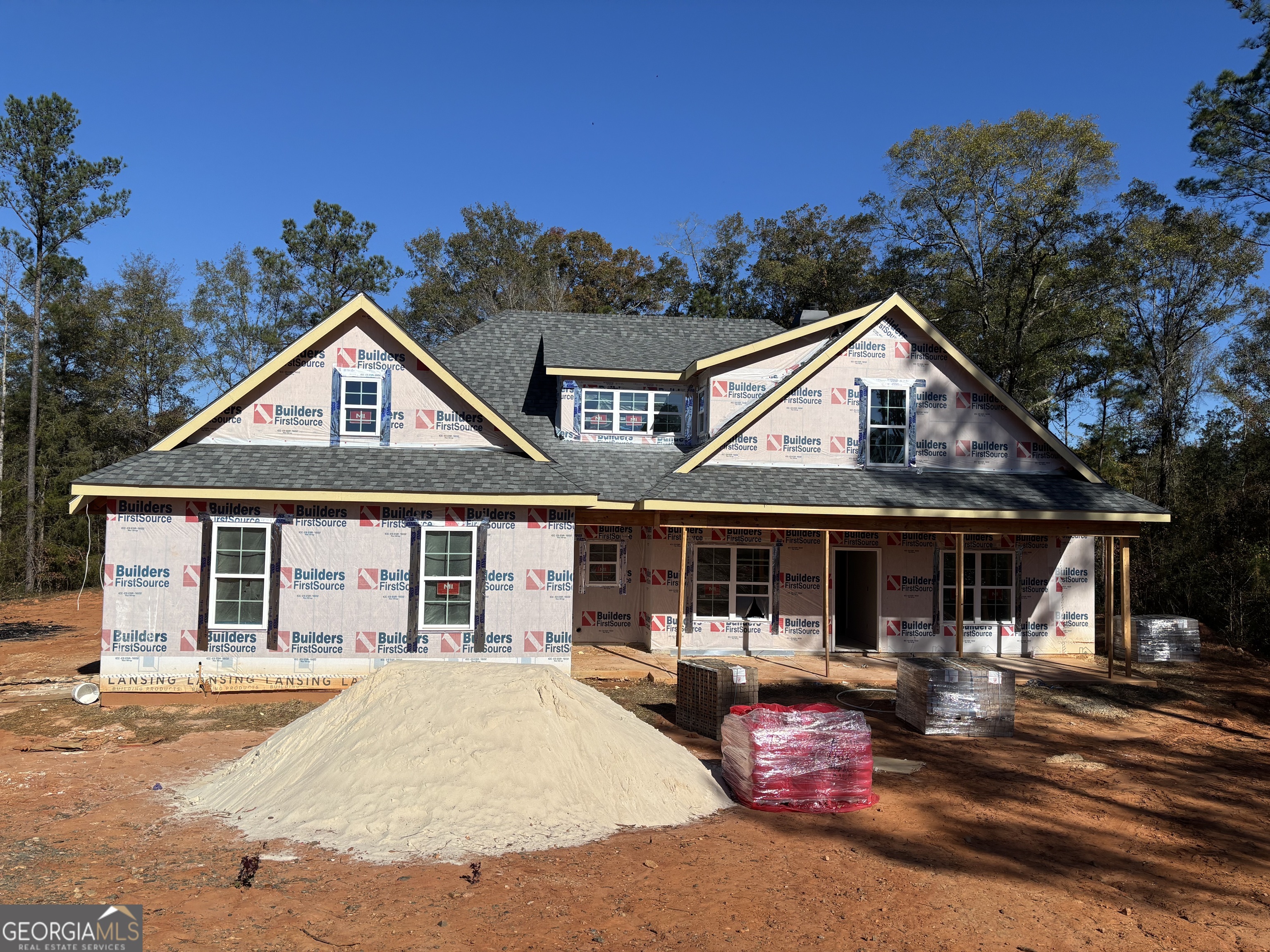 243 Copper Crossing Forsyth, GA 31029 - Photo 2 of 17 a front view of a house with yard porch and outdoor seating