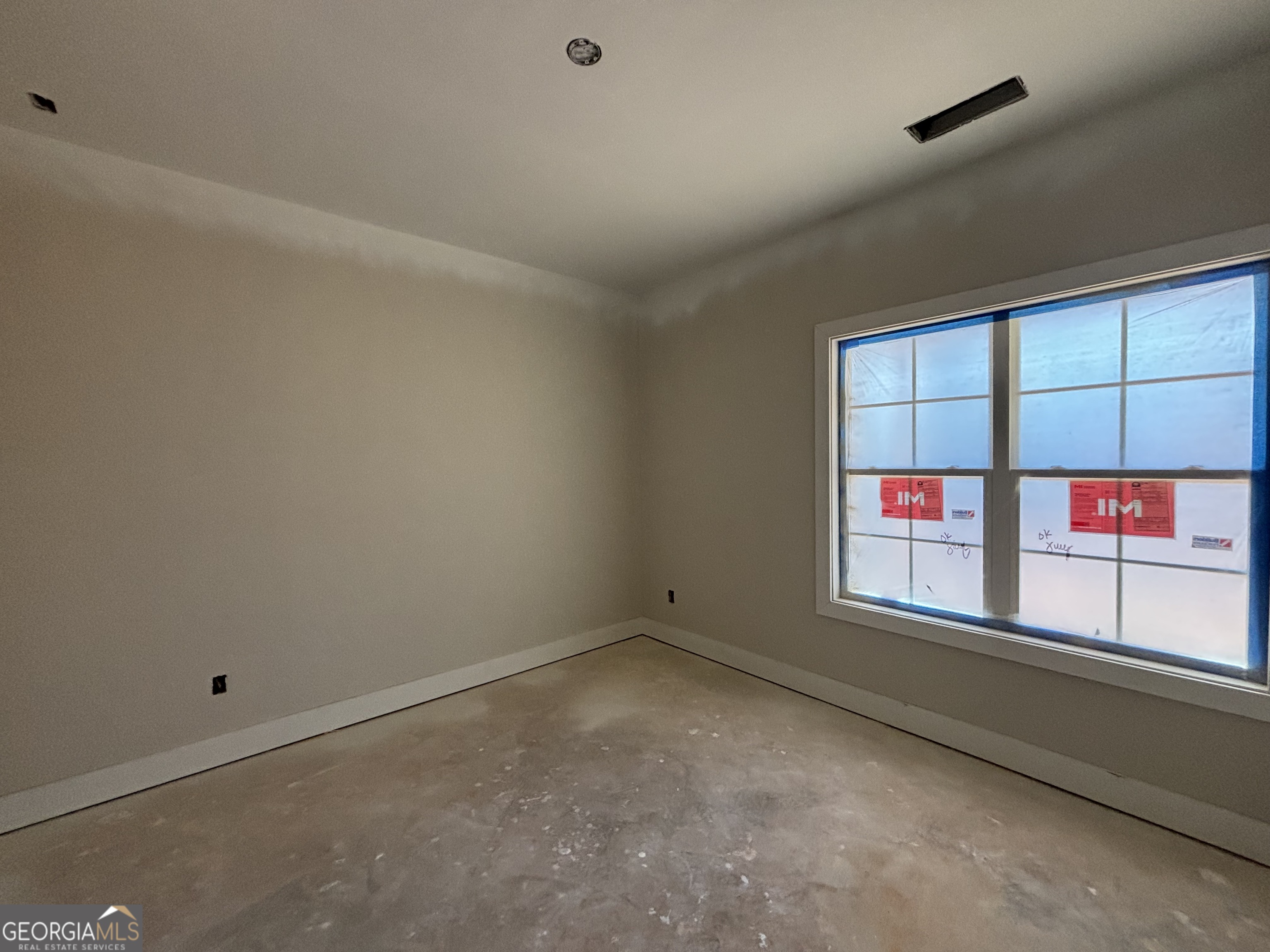 243 Copper Crossing Forsyth, GA 31029 - Photo 10 of 17 an empty room with windows