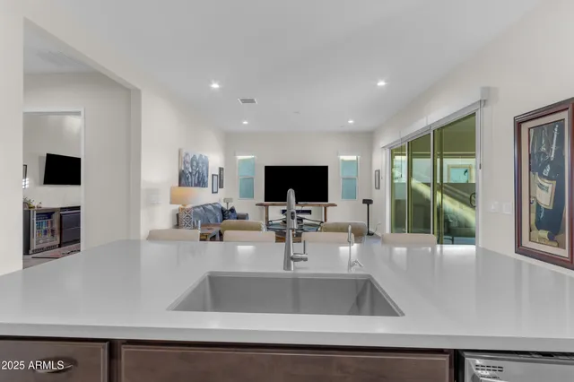 a view of walk in closet with clothes