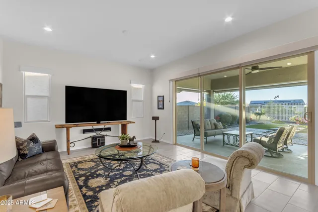 a living room with furniture and a swimming pool