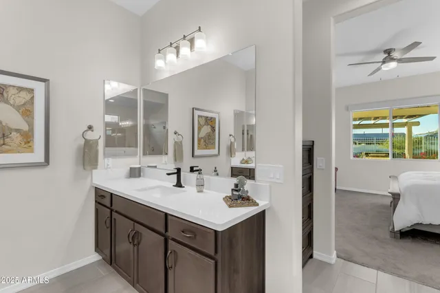 an aerial view of residential houses with outdoor space and ocean view