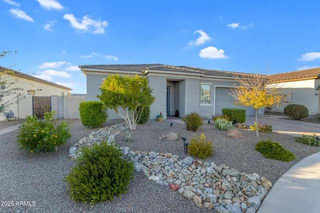 a view of a big room with chandelier fan