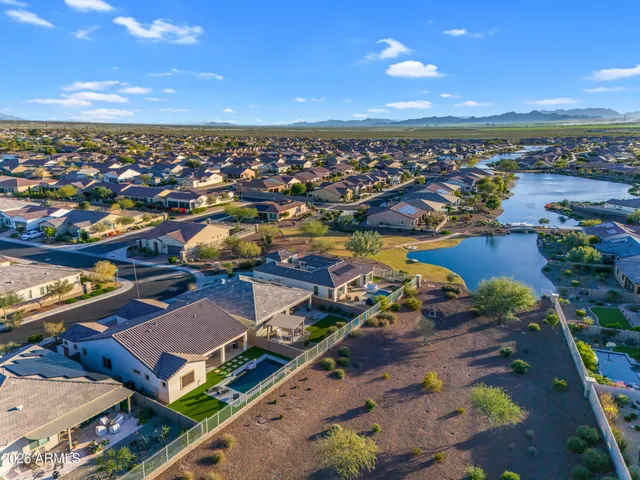 a view of a patio with table and chairs with plants and wooden floor