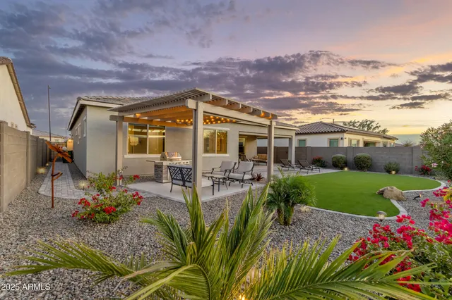 a kitchen with stainless steel appliances granite countertop a sink stove and microwave