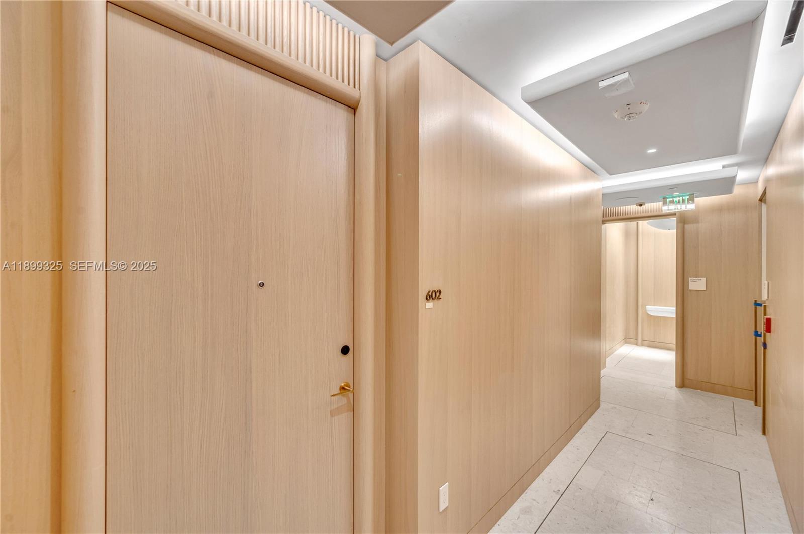 9149 Collins Avenue, Unit 602 Surfside, FL 33154 - Photo 4 of 8 a view of a hallway