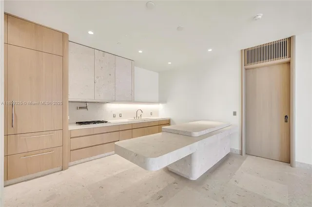 a room with a bed and a cabinets