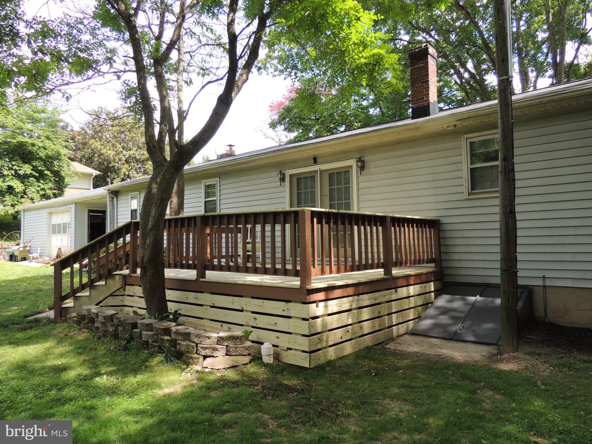 5838 Oklahoma Road Sykesville, MD 21784 - Photo 8 of 72 Charming deck nestled in lush greenery.