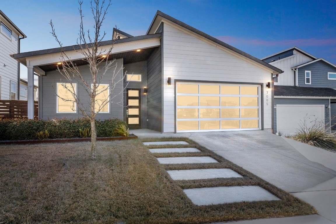 a view of a house with a street
