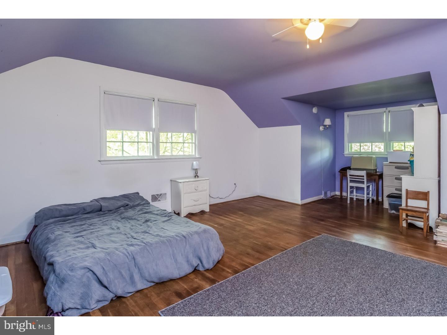 244 State Road Princeton, NJ 08540 - Photo 14 of 17 a spacious bedroom with a bed and a table in it