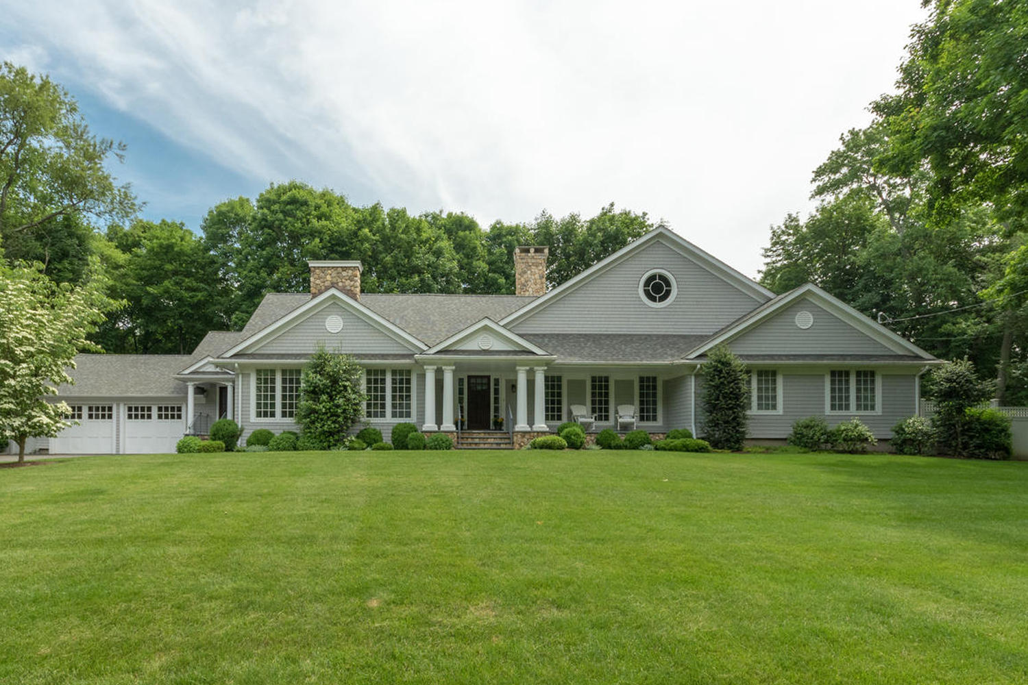 a front view of a house with a yard