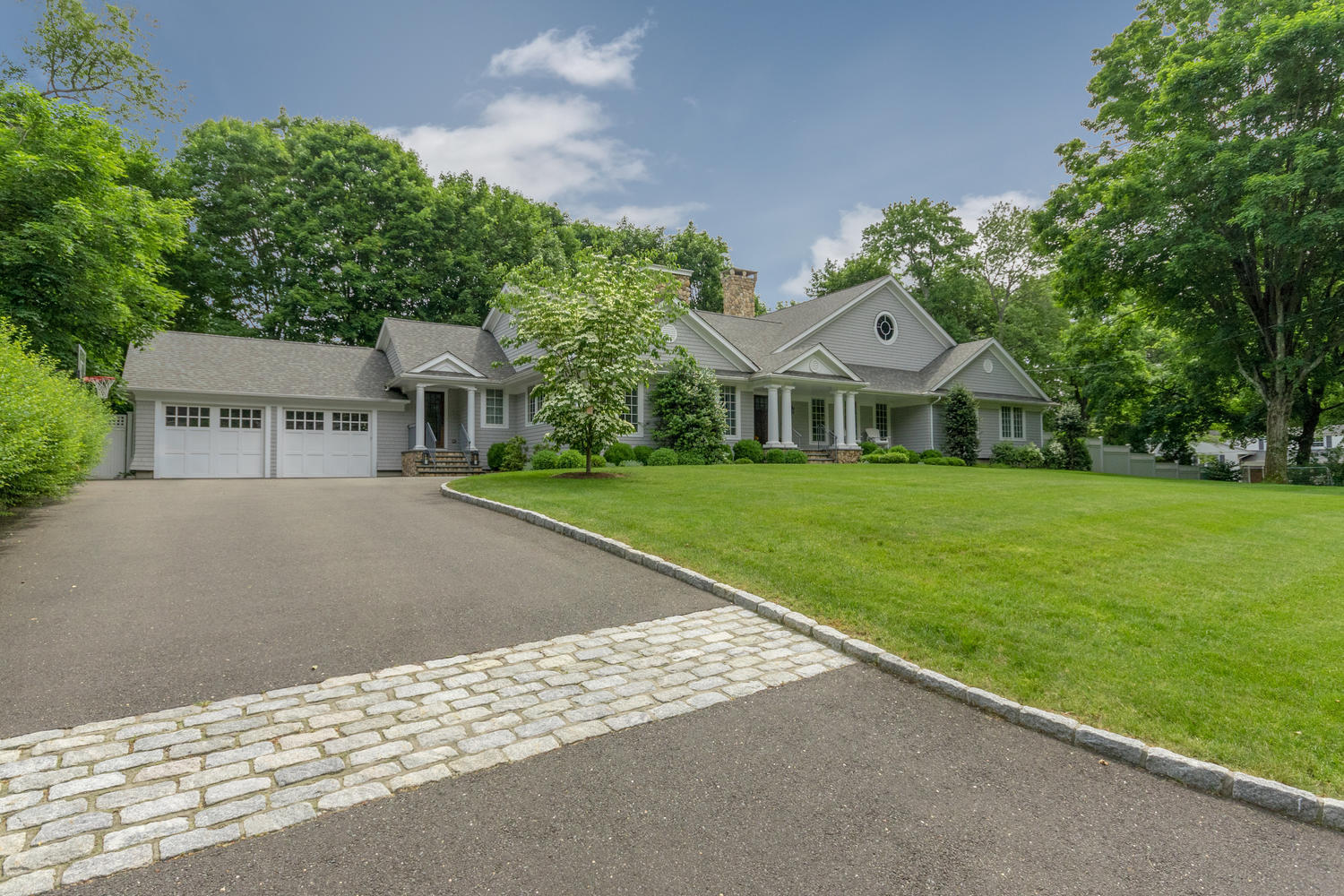 14 Deerfield Road Darien, CT 06820 - Photo 3 of 55 a front view of a house with a yard