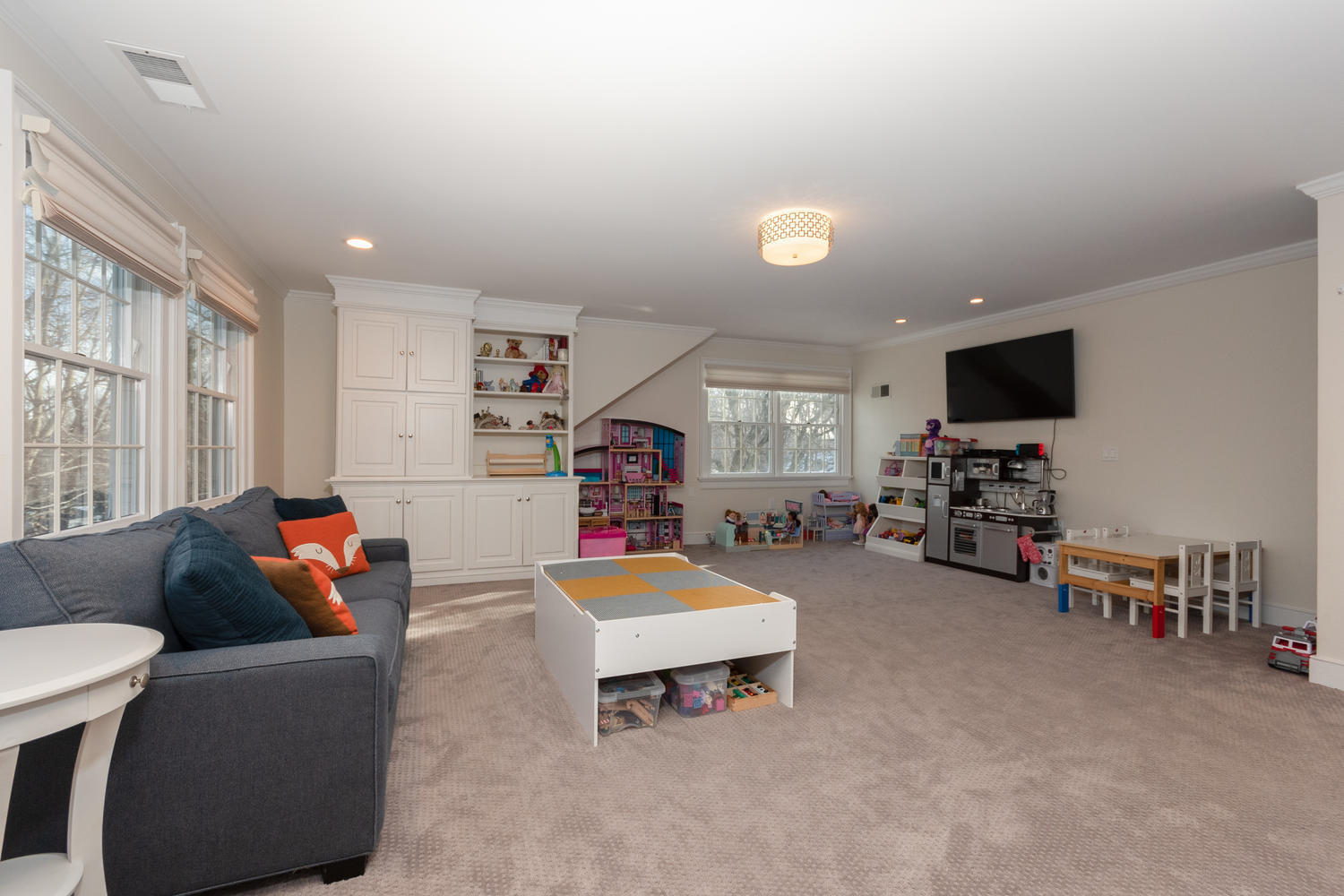 14 Deerfield Road Darien, CT 06820 - Photo 36 of 55 a living room with furniture and a flat screen tv
