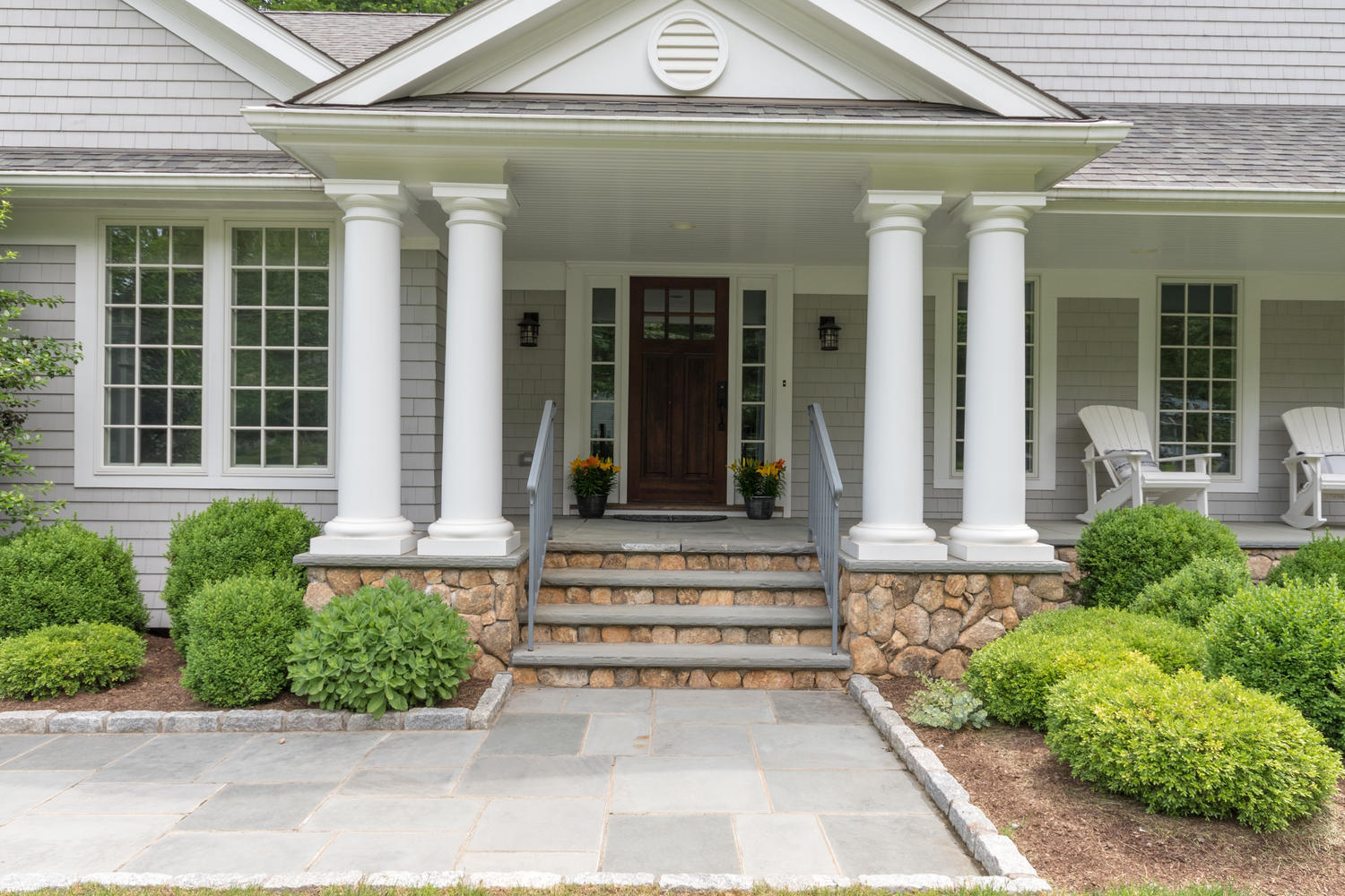 14 Deerfield Road Darien, CT 06820 - Photo 4 of 55 front view of a house with a large window and potted plants