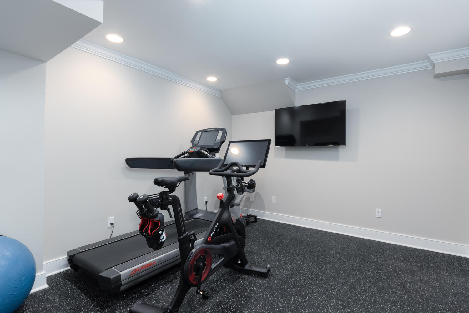 14 Deerfield Road Darien, CT 06820 - Photo 42 of 55 a room with gym equipment and a flat screen tv