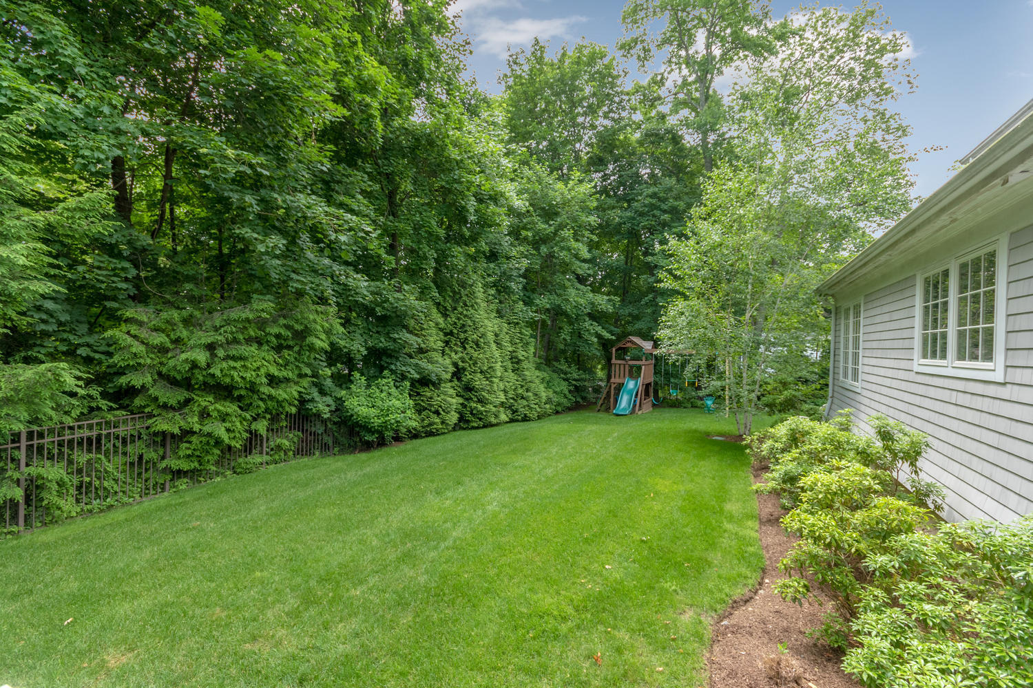 14 Deerfield Road Darien, CT 06820 - Photo 48 of 55 a view of a backyard with a garden