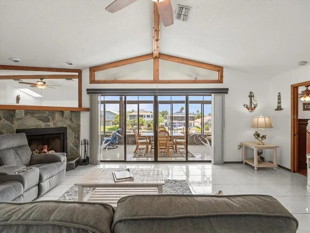 a living room with furniture a rug and white walls