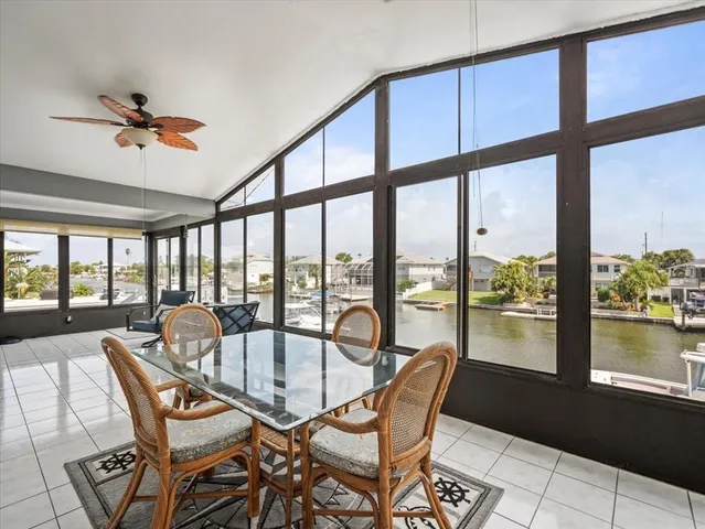 a bedroom with a large bed and a large window