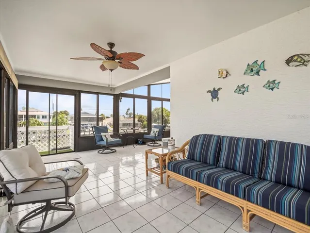 a bathroom with a granite countertop sink mirror vanity and toilet