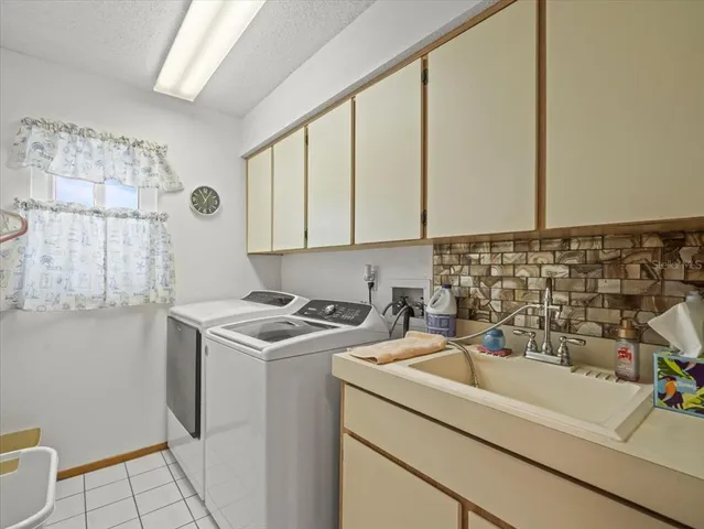 a bathroom with a granite countertop sink mirror vanity and toilet