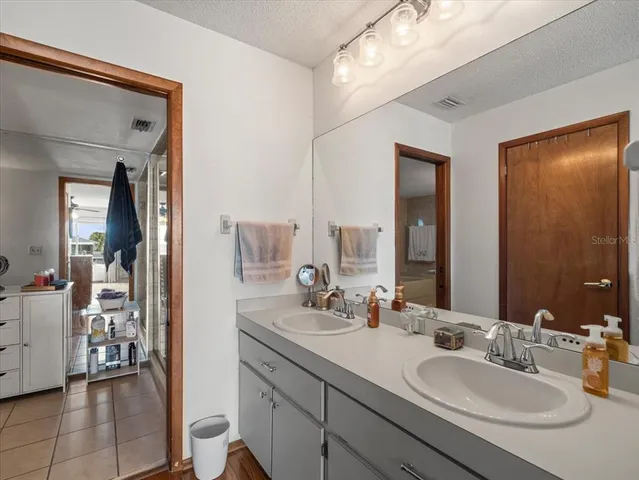 a bedroom with a bed and cabinets