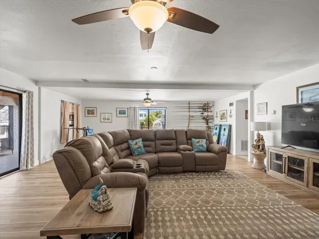 a view of a terrace with furniture and a lake view