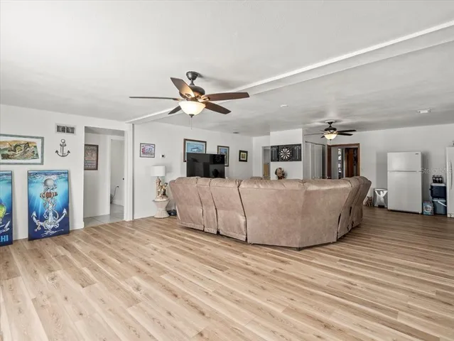 a view of porch with furniture and a deck