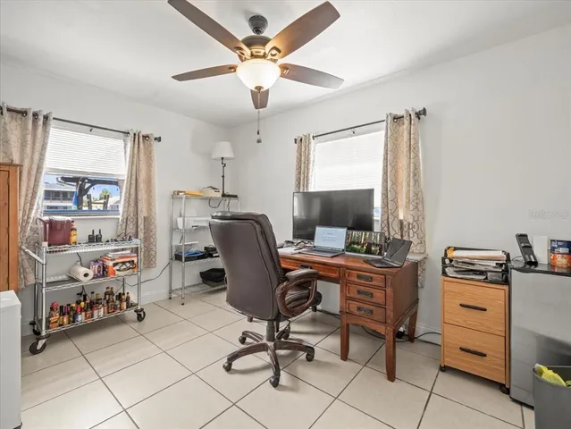 a view of a lake with boats and large trees