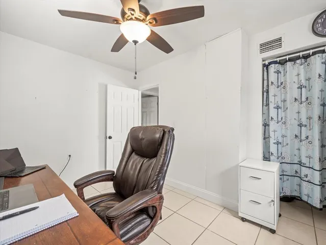 a aerial view of a house with swimming pool and furniture