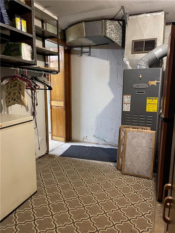 291 Dutch Glory Road Amity, PA 15311 - Photo 22 of 25 a bedroom with a bed and a refrigerator