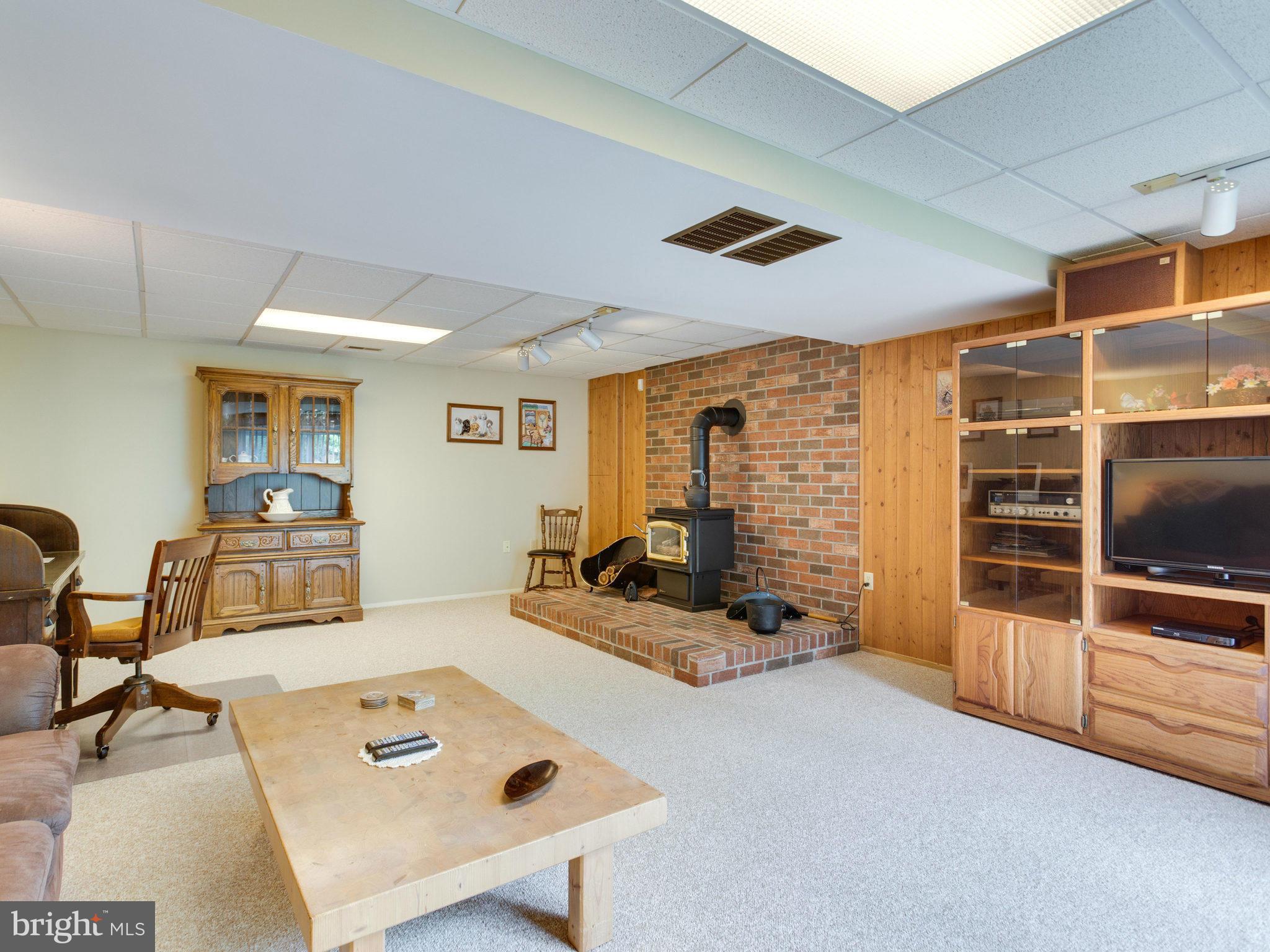 5697 Linton Road Sykesville, MD 21784 - Photo 21 of 30 Rec Room with Gas Heating Stove