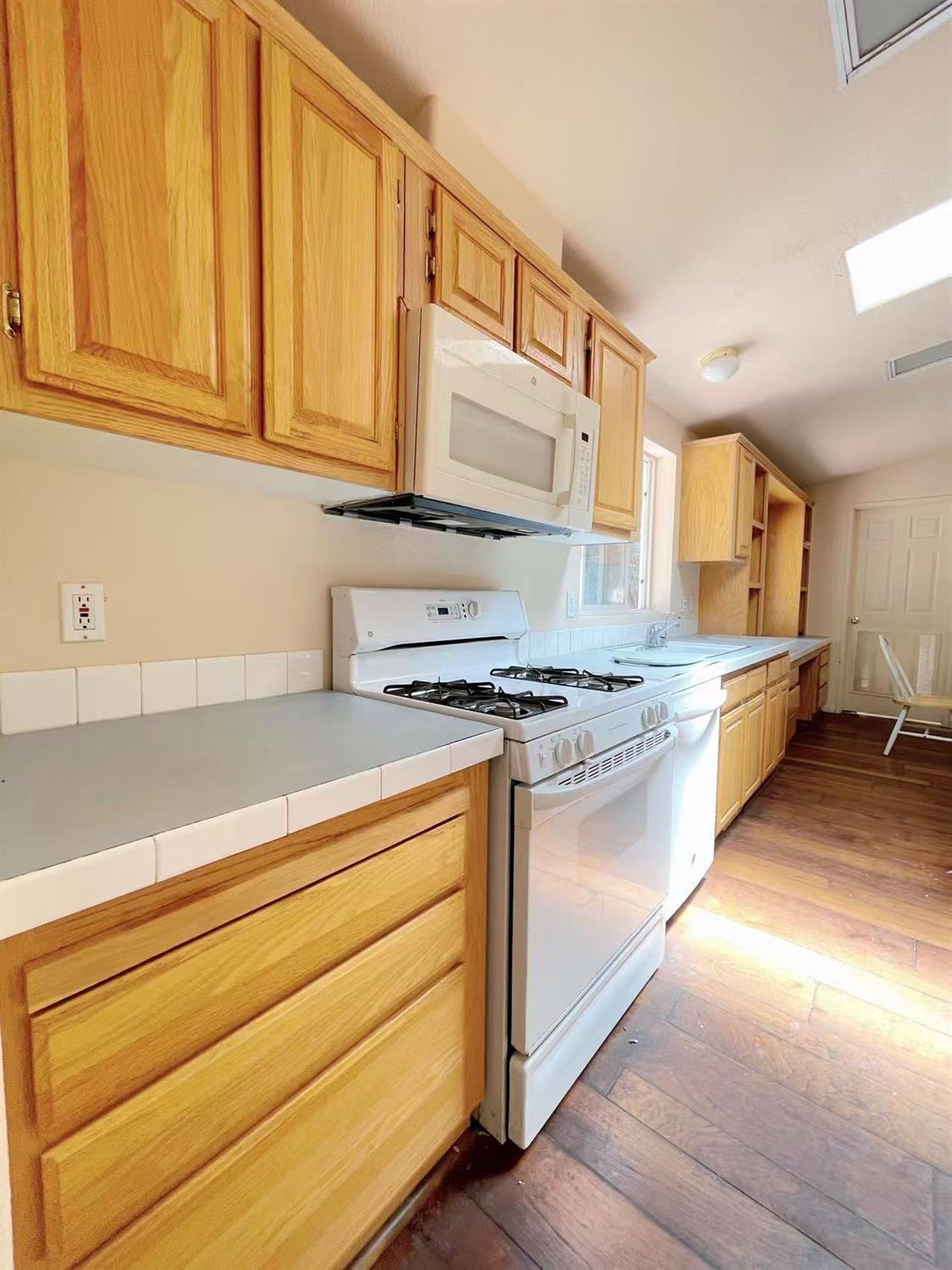 112 Renegade Road Oroville, CA 95966 - Photo 13 of 38 a kitchen with stainless steel appliances granite countertop a sink and cabinets