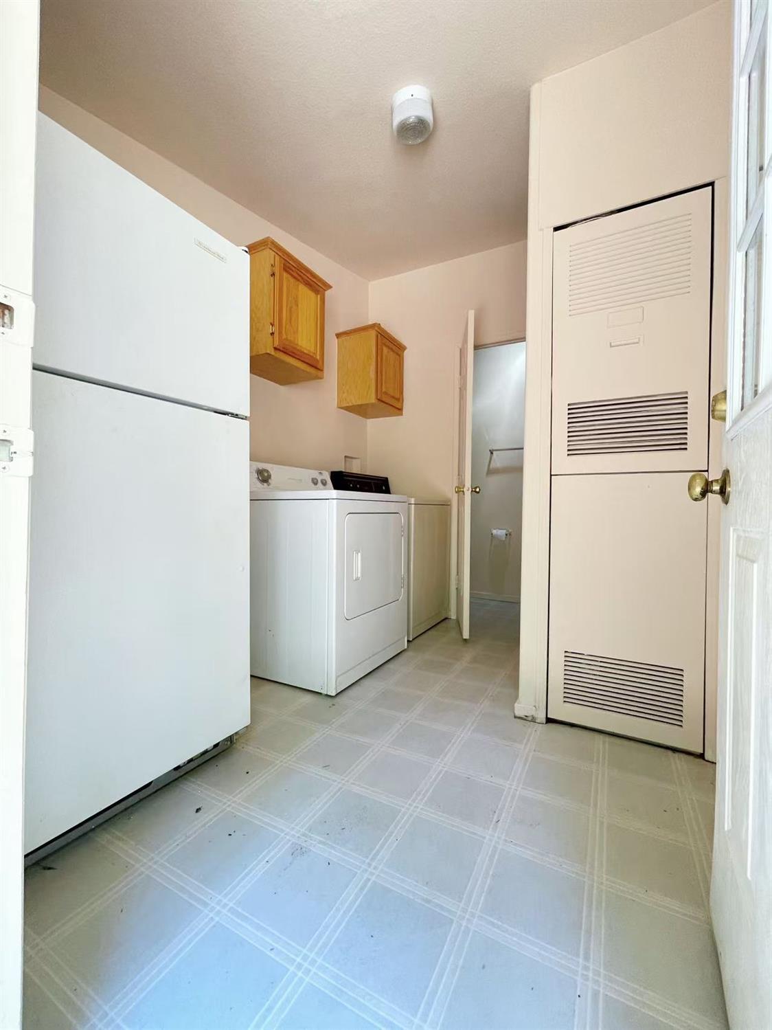 112 Renegade Road Oroville, CA 95966 - Photo 14 of 38 a room with refrigerator and cabinet