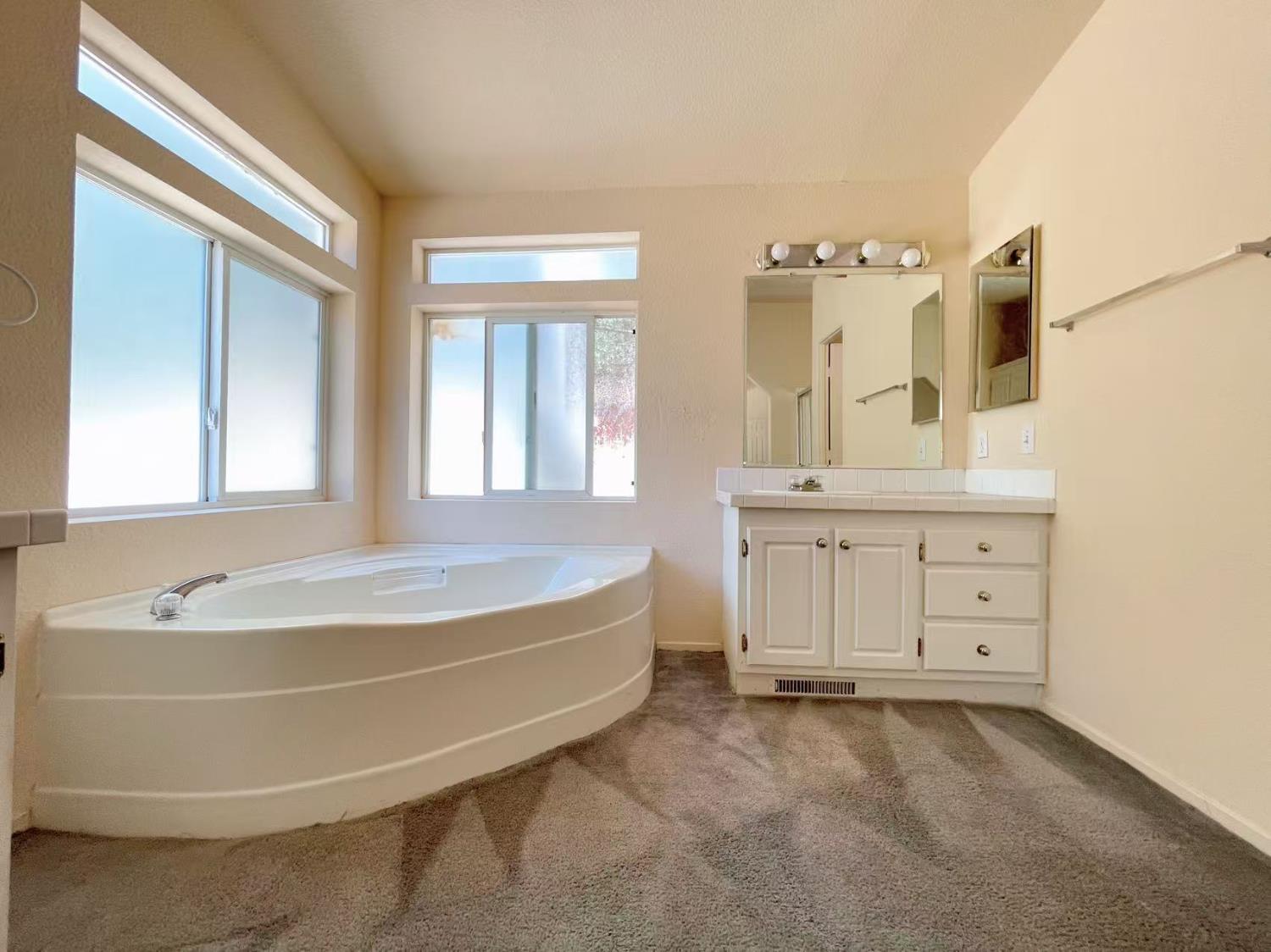 112 Renegade Road Oroville, CA 95966 - Photo 19 of 38 a spacious bathroom with sink double vanity mirror and bathtub