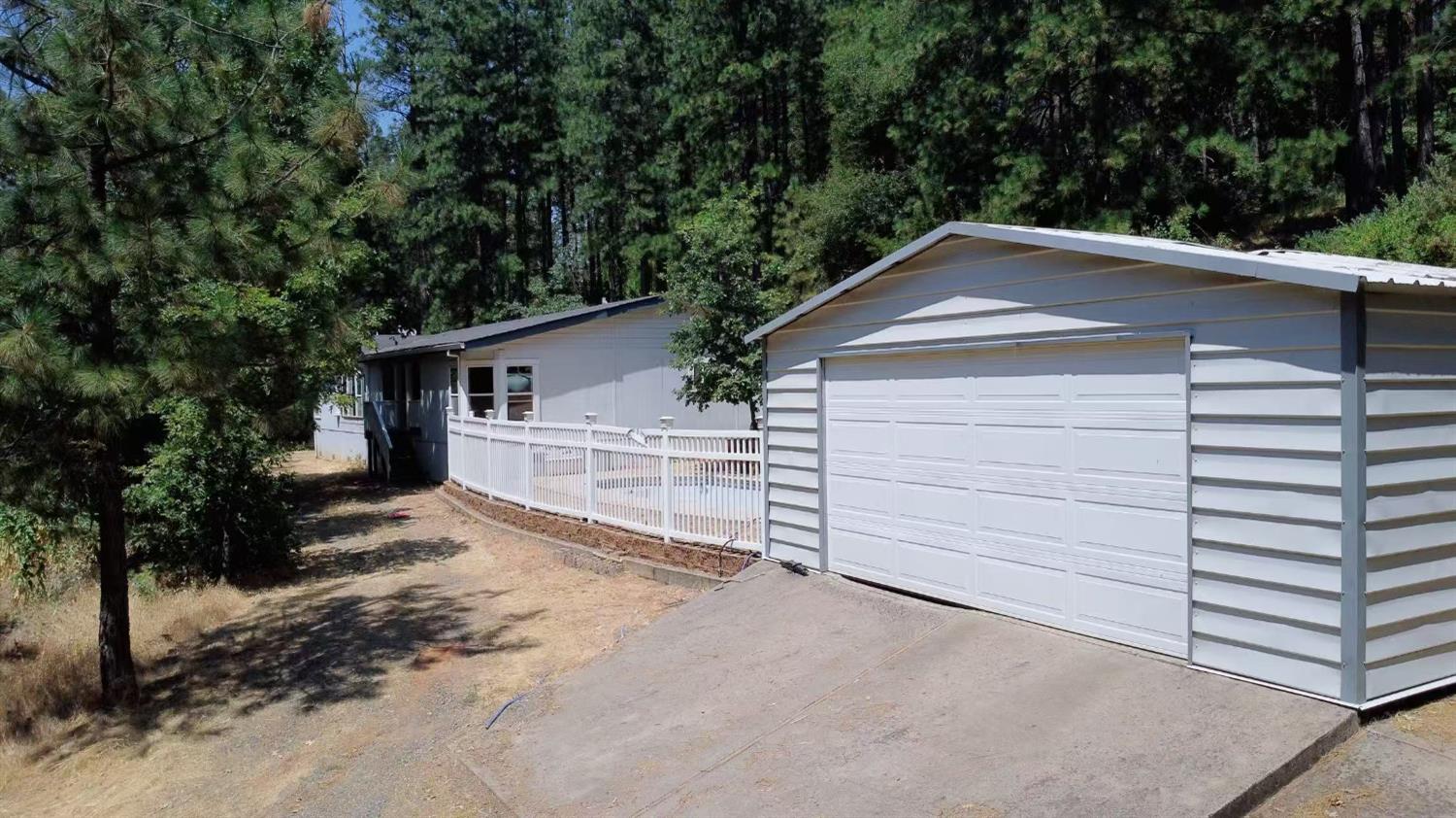 112 Renegade Road Oroville, CA 95966 - Photo 2 of 38 a front view of a house with a yard