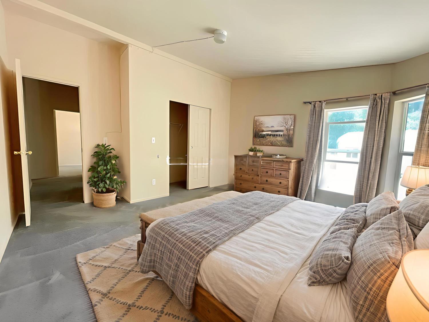 112 Renegade Road Oroville, CA 95966 - Photo 21 of 38 a spacious bedroom with a bed and a dresser