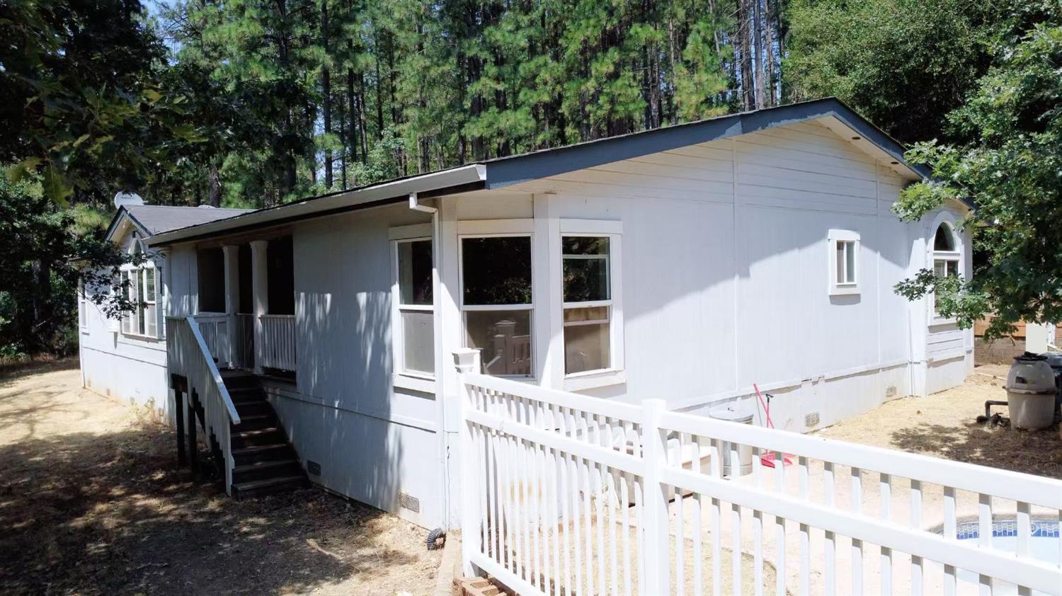 112 Renegade Road Oroville, CA 95966 - Photo 3 of 38 a view of a house with backyard and sitting area