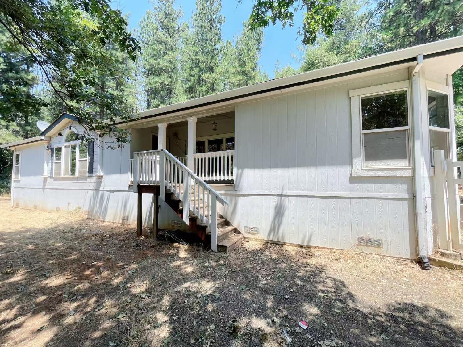 112 Renegade Road Oroville, CA 95966 - Photo 4 of 38 a view of a house with a backyard