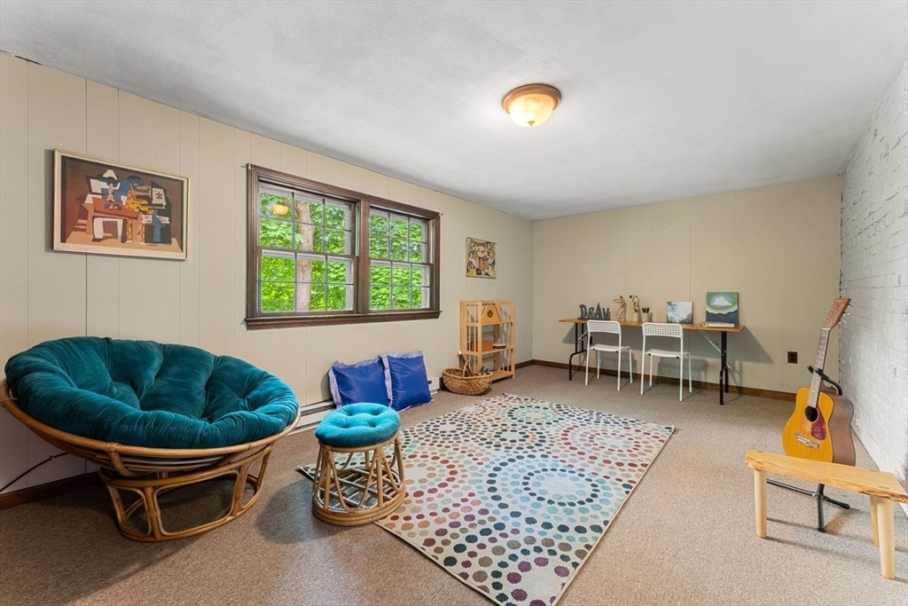 18 Burnside Road Newton, MA 02461 - Photo 13 of 27 a living room with furniture a rug and a window
