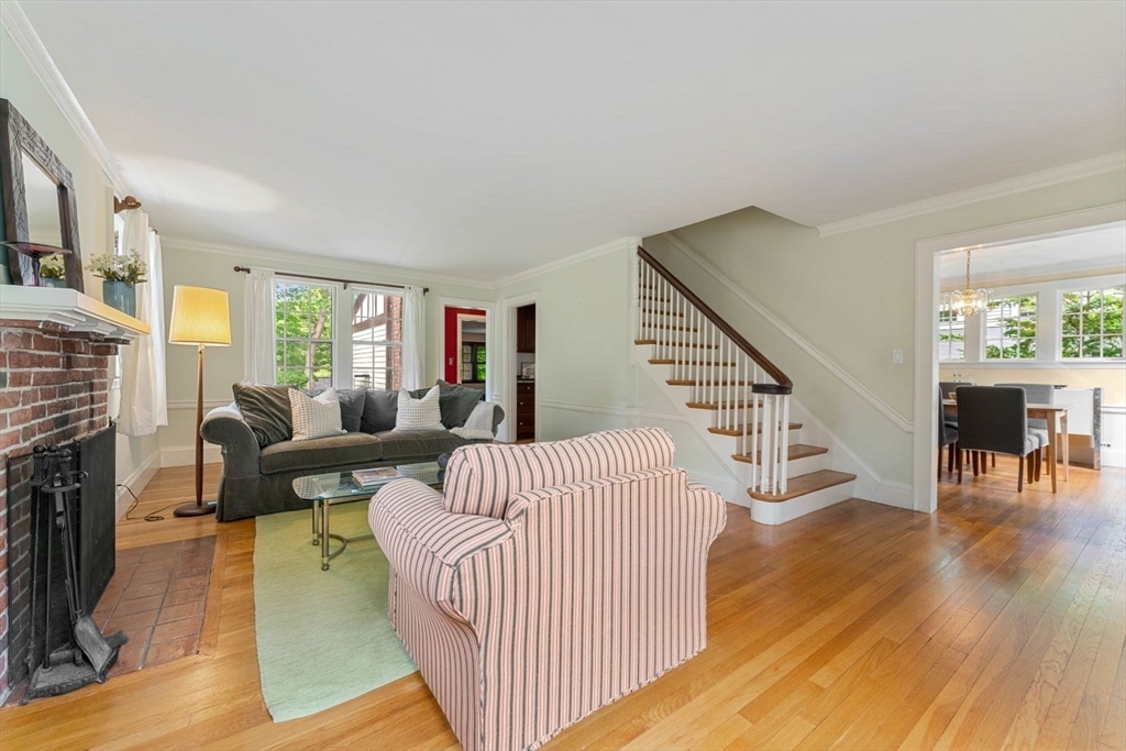 18 Burnside Road Newton, MA 02461 - Photo 6 of 27 a living room with fireplace furniture and a wooden floor