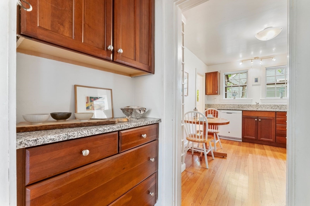 18 Burnside Road Newton, MA 02461 - Photo 7 of 27 a kitchen with granite countertop cabinets and chair