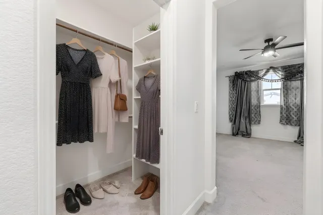a bathroom with a granite countertop sink a toilet and a mirror