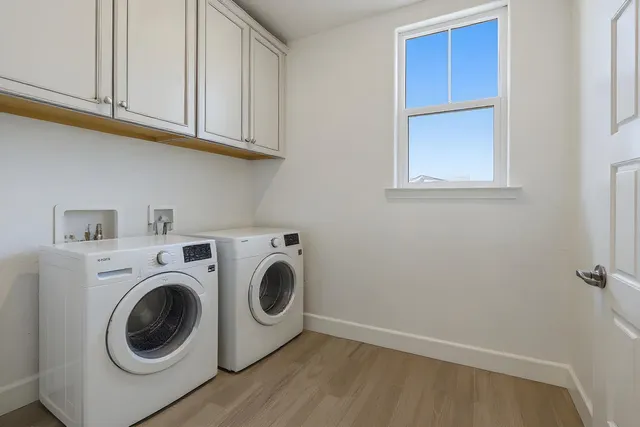 a view of an empty room with a chandelier