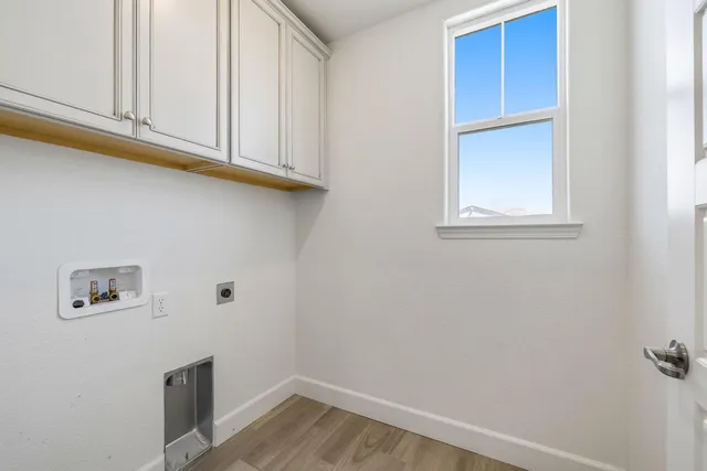 a view of a kitchen with a sink and a window