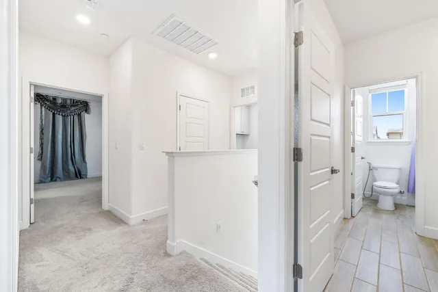 a view of a bathroom with a glass door shower