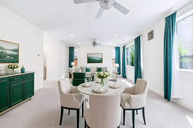 a view of a kitchen with a sink and refrigerator