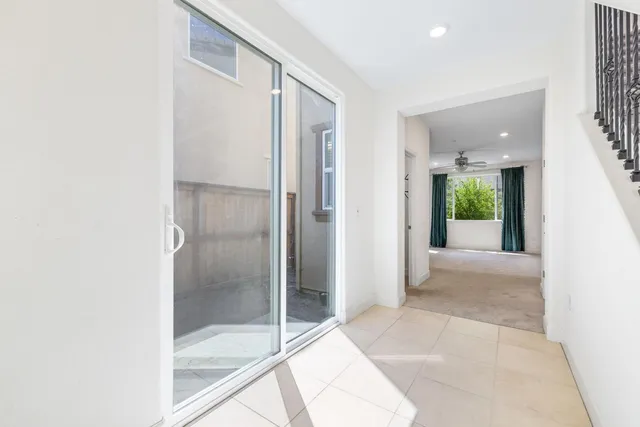 a view of a kitchen with a sink and stainless steel appliances