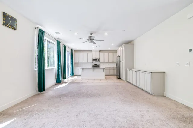 a view of a bathroom with a sink and a large mirror