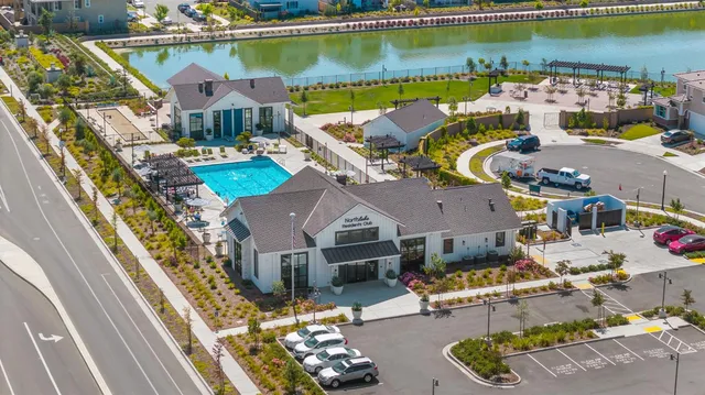 an aerial view of a house with a lake view