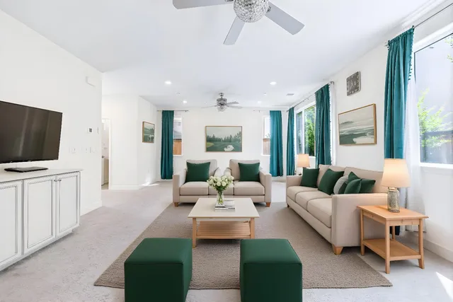 a living room with furniture fireplace and a flat screen tv
